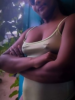 Asian woman with large breasts exposes herself in photos